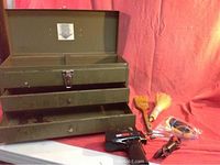 Photo of green metal Park tool chest with drawers, including some hand tools and soldering gun in front