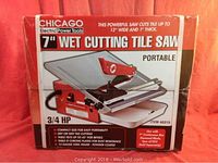 Front view of the boxed Chicago Electric 7" Wet Cutting Tile Saw showing brand, key features, 3/4 HP motor, and specifications.