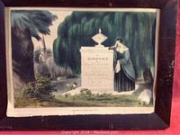 Full color lithograph print in original frame showing woman mourning at a stone monument in a landscape.