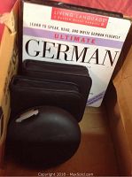 Box shot showing Living Language Ultimate German language course and black CD cases.