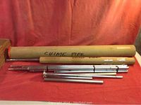 Photo showing the chime pipes of various lengths, some inside cardboard tubes labeled 'CHIME PIPE'