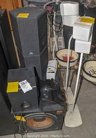 Overall view showing Klipsch subwoofer and floor speakers, Insignia computer speaker, Energy stands with satellites