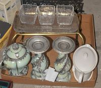 Full view of candlestick holders, gravy warmer, glass tray and glass holders arranged in box.