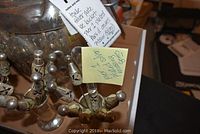 Photo showing decorative picks with colorful stones and silver plating, includes notes describing items as Towle silver plate ice cube picks and others.