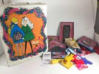 Front and side of white vinyl Barbie doll trunk with colorful 1968 era illustration of two Barbie dolls.