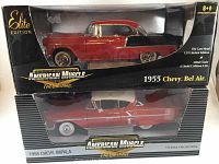 Front and side view of both boxed model cars showing packaging and model details