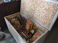 Top open view of cedar chest interior lined with patterned material, showing empty storage space