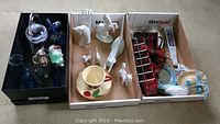 Box containing assorted porcelain and glass figurines and decorative items including the Lipizzan stallion and Royal Dux cats