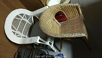 Overhead view showing the natural brown wicker chair with a diamond pattern woven into the backrest and the white wicker chair behind it.