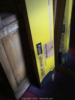 Yellow and black box with Thule 599 Ultimate Upright bike carrier branding and image showing the bike carrier product type and model number.