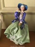 Front angle of the Royal Doulton porcelain figurine showing full figure and colors