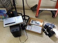 Full view of receiver, subwoofer, 5 speakers, and box with manuals and CDs