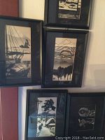 Six black framed Asian ink-style landscape and children prints with glass, slight wear on frames