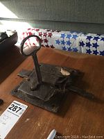 Photo of the large antique lock inserted with the skeleton key showing working mechanism and rust wear