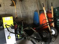 Overall view of all tools grouped against concrete wall