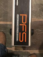 Base of rail showing PFS Performance Fitness Systems branding in orange and white on black panel
