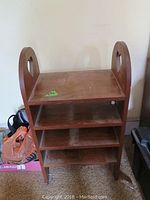 Country style wooden shelf unit with heart-shaped cut-outs on sides, showing shape and size.