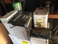 View showing Breadman bread machine, Fellowes and Royal paper shredders, and assorted decorative tins in background