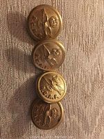 Four vintage Royal Canadian Air Force military buttons with embossed eagle and crown design and 'R.C.A.F.' lettering, arranged vertically.