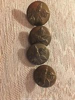 Four vintage brass-tone Royal Canadian Air Force buttons with flying eagle and crown, no text