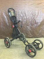 Side view of the 3-wheel golf bag caddy showing the frame, wheels, and handle with cushion grips