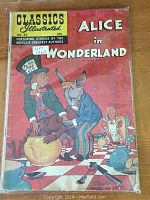 Front cover of the Alice in Wonderland comic book showing the illustrated characters and wear from age. Comic book is in a plastic protective sleeve.