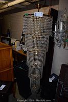 Full view of chandelier showing multiple tiers and overall form