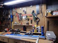 Workbench and pegboard view showing tools and levels