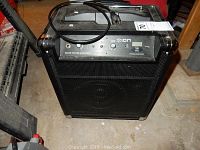 Full front view of Ion Block Rocker Bluetooth portable sound system with power cord and controls visible.