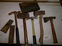 Full lot including six hammers/axes and two splitting wedges plus sharpening stone box.