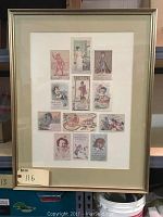 Framed Victorian advertising postcards front view showing all 12 postcards arranged in three rows inside a cream mat, gold-tone frame measuring 22 by 28 inches.