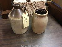 Photo of salt glazed stoneware jug and crock together on table, showing both items side by side.