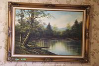 Full view of oil painting in ornate gold-tone frame hung on floral wallpaper background.