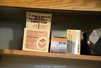 Voltage converter, OSRAM 20W Dulux EL bulb, Door Guard electric security alarm in original boxes on shelf