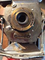 Close-up photo of Eastman Kodak Pocket Automatic folding camera showing lens and company markings