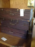 Wooden storage boxes closed, showing external condition and storage method of accessories