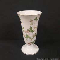 Front view of the Wedgwood bone china vase showing the Wild Strawberry pattern with green leaves, pink flowers, and red strawberries on a white background with gold trim.