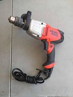 Side view of Black & Decker impact driver showing ergonomic handle and chuck.