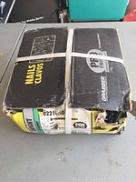 Box of Grabber Pro Bright Cut Masonry Nails showing brand, product type, size, weight and condition of box with tear and damaged corner.