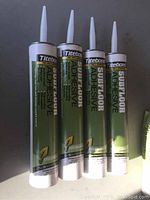 Four tubes of Titebond Subfloor Adhesive arranged side by side showing product front labels.