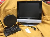 Polaroid 15 inch TV with power cord, showing front display and logo