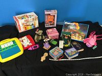 Full shot showing all items including toys, dolls, and lunch kits.