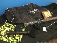 Top Flight XL golf bag along with golf cart umbrella, decorative pillow, putter, golf club sock, and camouflage golf shoe bag