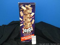Box packaging showing the Jenga Giant branding and stacking height capabilities up to 3 feet and higher.