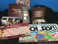Group of boxed classic games including Scrabble, Truth and Triumph, Twisted Nails, Sorry!, and wooden backgammon set
