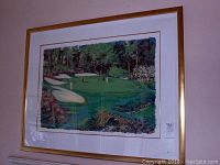 Full frontal view of framed print hanging on wall