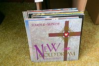 First photo showing the Simple Minds New Gold Dream LP record at the front of the stack with other records behind it.