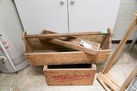 Full view of vintage wooden toolbox with removable tray inside and wooden crate below.