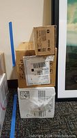 Stack of four cardboard boxes of Xerox copier toner cartridges and supplies.