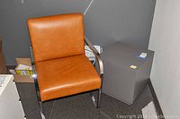 Williams Sonoma office chair next to cube table showing chair upholstery and chrome frame